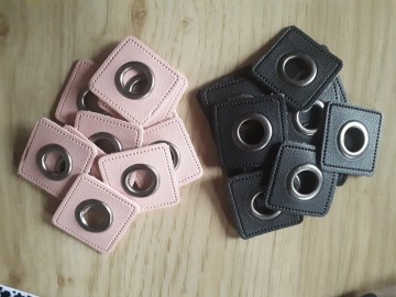 Nestels op roze leer