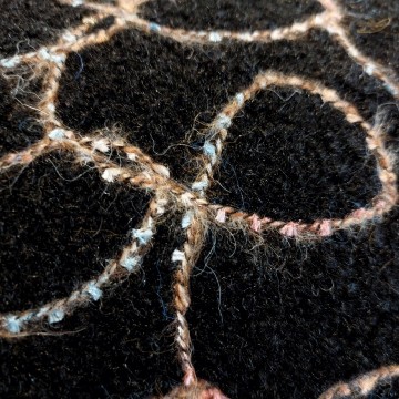 geboorduurde jassenstof